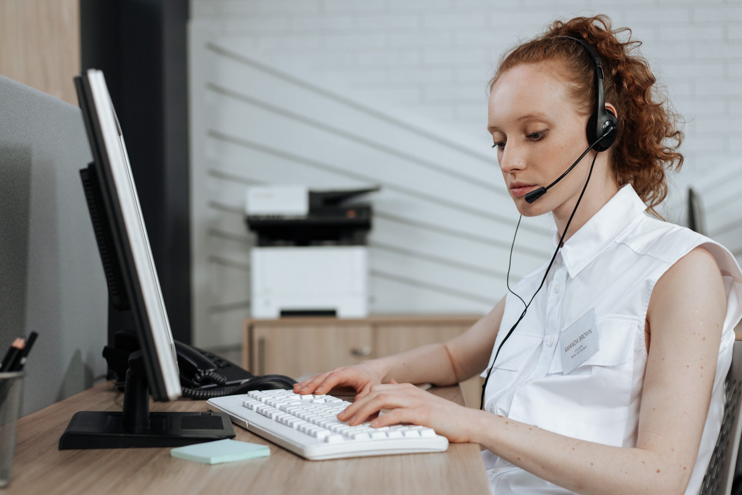 nexa receptionist typing on her computer